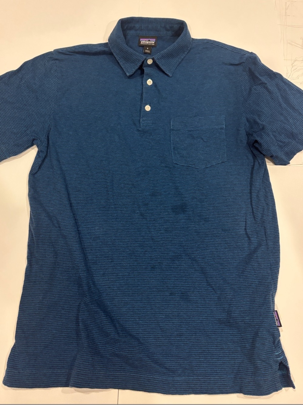 Patagonia Men's Navy Blue Short-Sleeve Polo with Chest Pocket.
